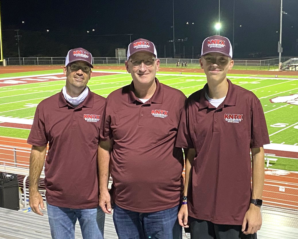 the KNTX sports team: three guys at the football field