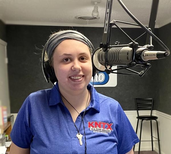 Jessica Reeves Board Op at KNTX radio on the microphone