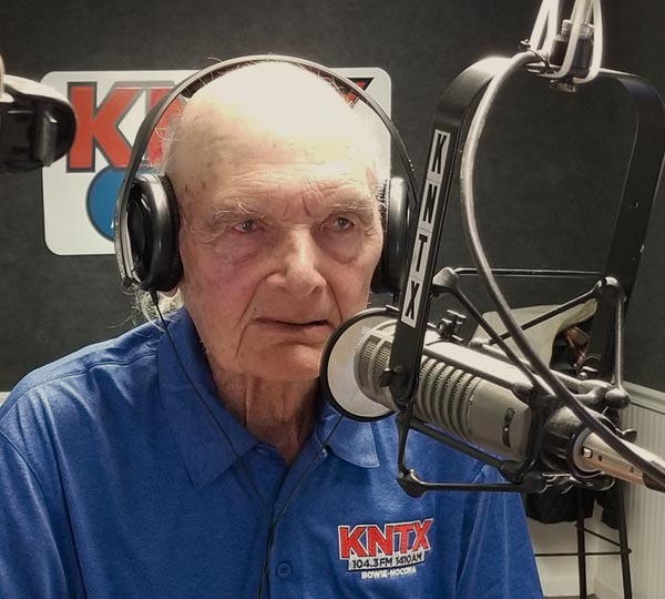 Lester Boyd at the microphone in the KNTX radio studio